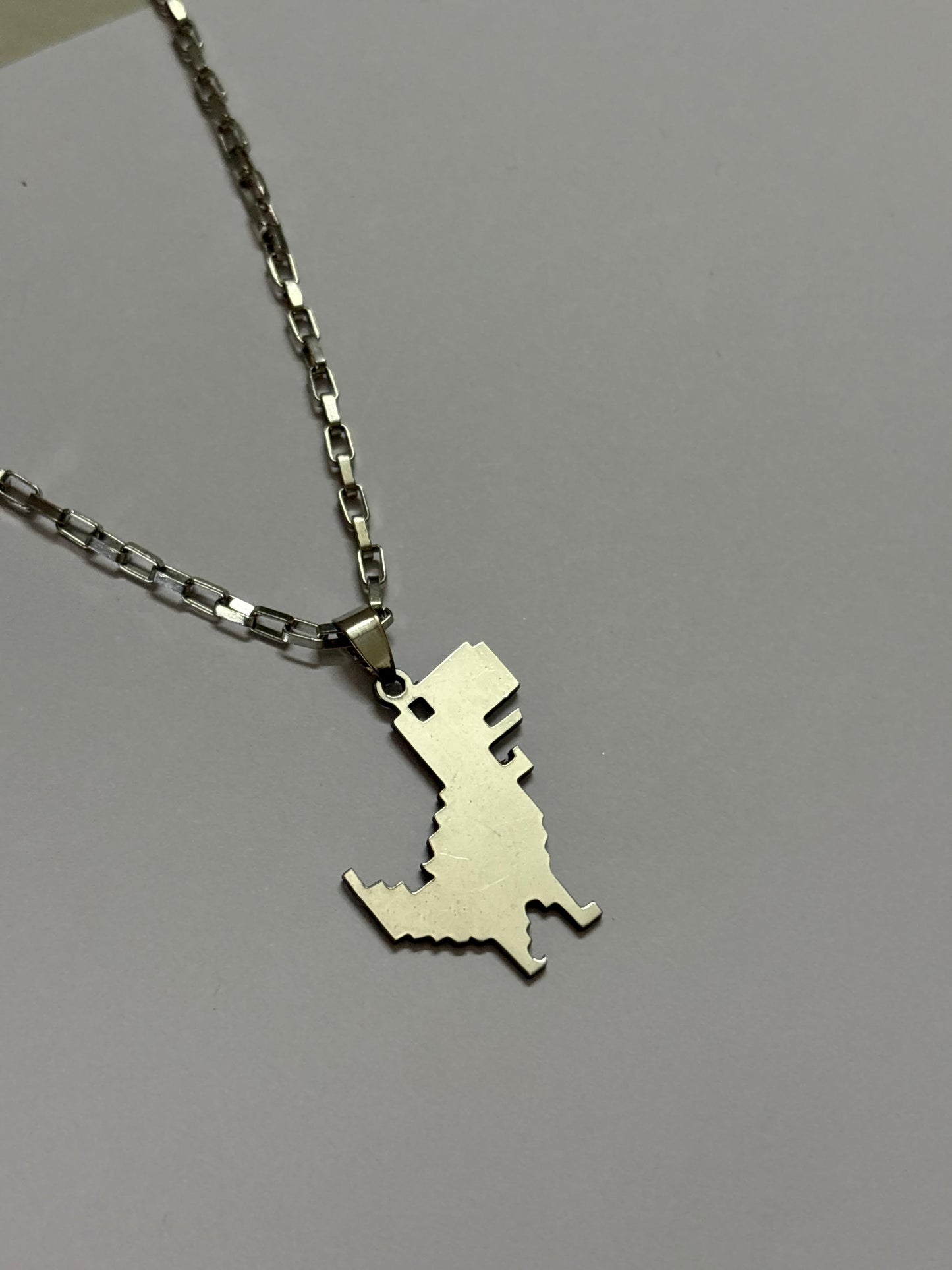 G Dino neckpiece