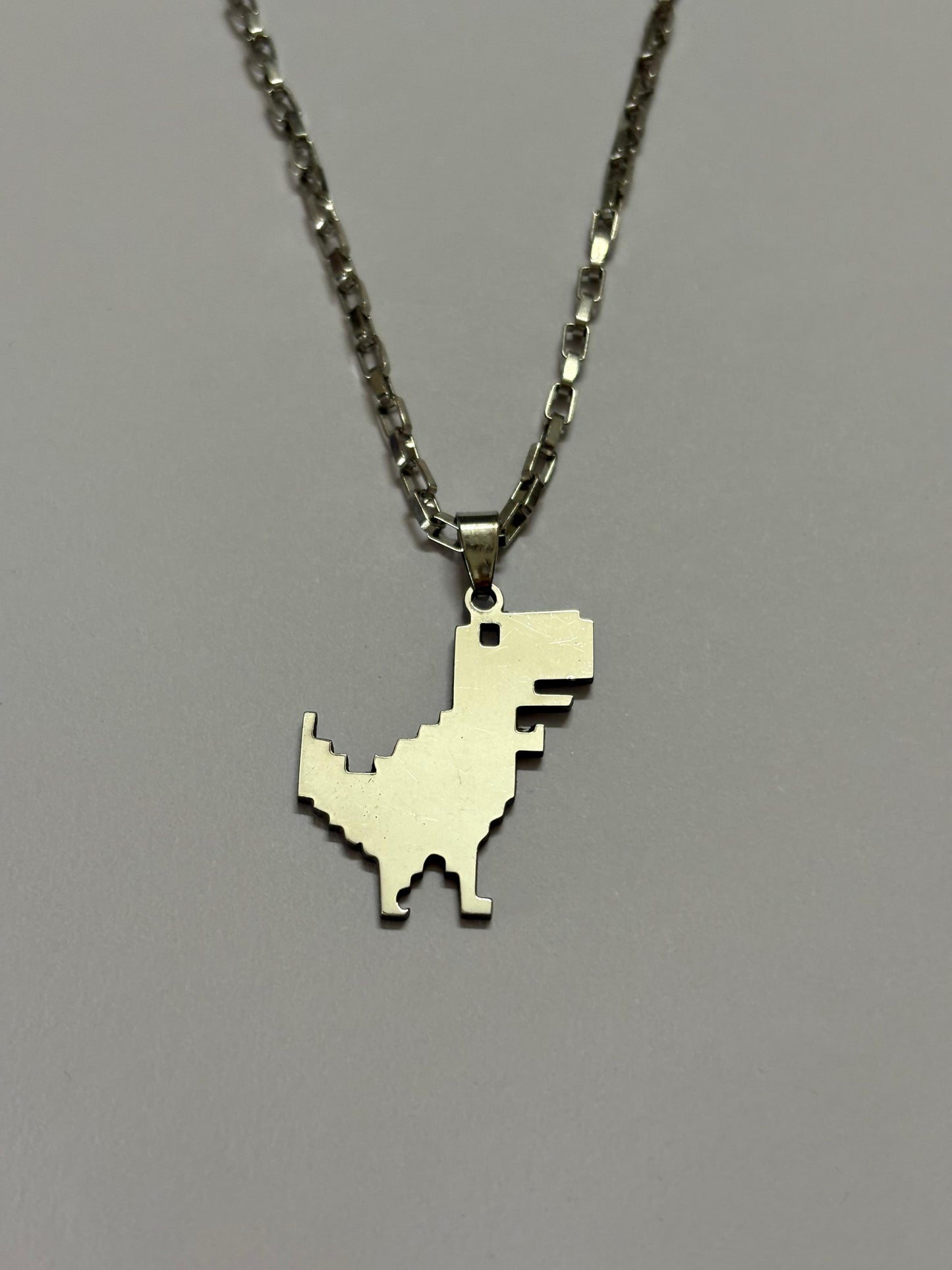 G Dino neckpiece